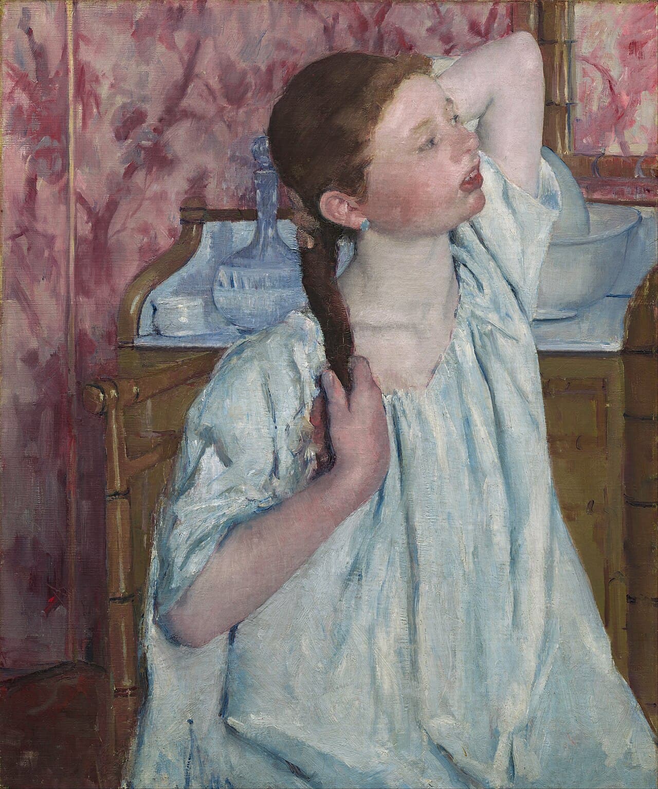 Girl Arranging Her Hair by Mary Cassatt (1886)